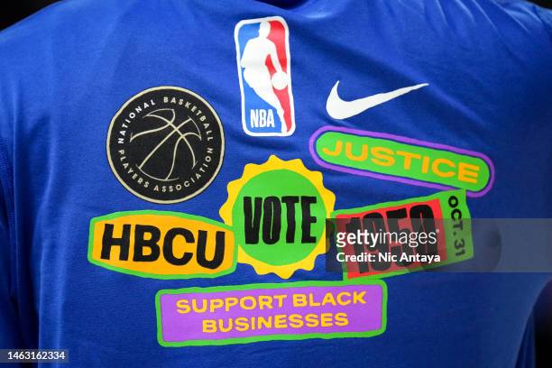 Shirt in support of Black History Month is worn by a Detroit Pistons player against the Charlotte Hornets at Little Caesars Arena on February 03,...