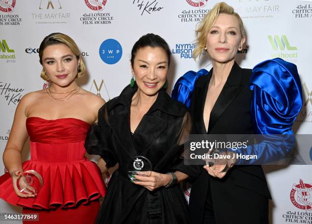 Florence Pugh, winner of the British/Irish Actress Of The Year For Body Of Work Award, Michelle Yeoh, winner of the Dilys Powell Award For Excellence...