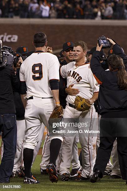 Matt Cain of the San Francisco Giants is congratulated by teammates after the game against the Houston Astros at AT&T Park on June 13, 2012 in San...