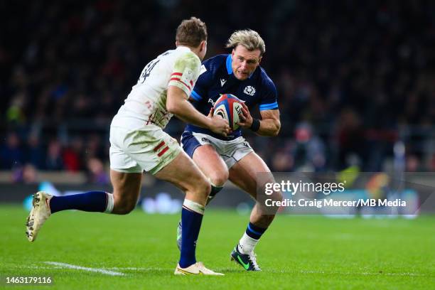 Stuart Hogg of Scotland takes on Max Malins of England during the Six Nations Rugby match between England and Scotland at Twickenham Stadium on...