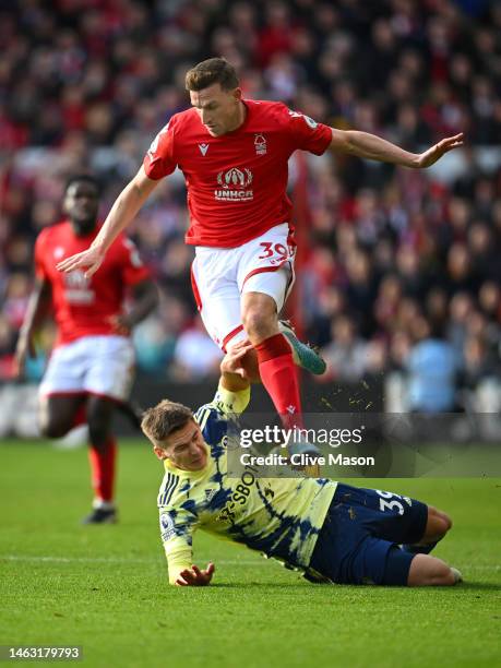Chris Wood of Nottingham Forest battles for possession with Maximilian Woeber of Leeds United during the Premier League match between Nottingham...