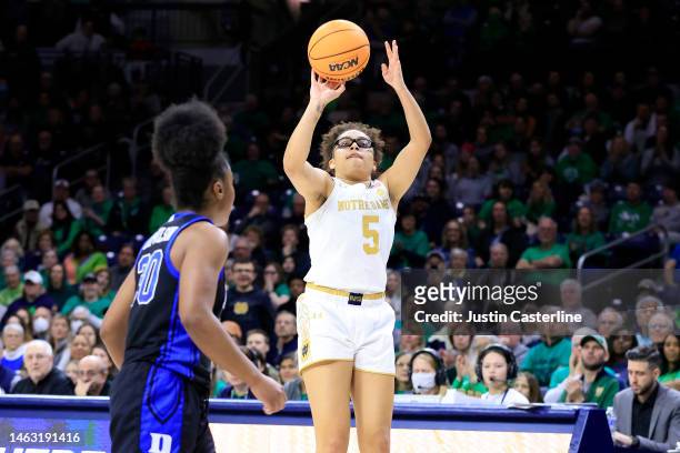 Olivia Miles of the Notre Dame Fighting Irish takes a shot while defended by Shayeann Day-Wilson of the Duke Blue Devils during the second half of...