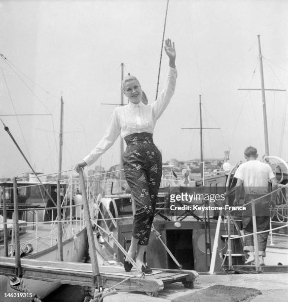 American actress Grace Kelly waves on a boat in Cannes for the international film festival in April - May ,1955 in Cannes, France. This is on this...