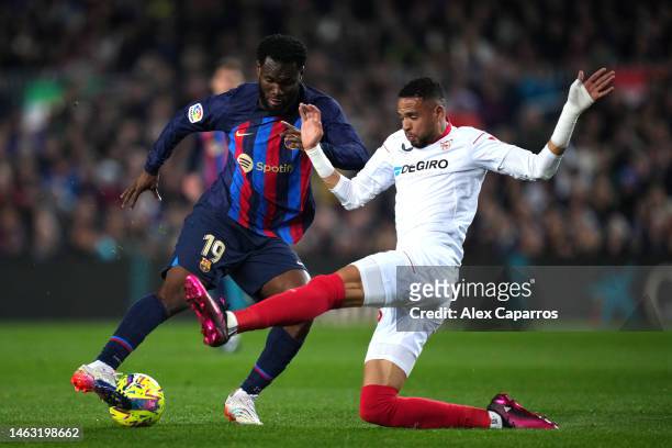 Franck Kessie of FC Barcelona is challenged by Yousseff En-Nesyri of Sevilla FC during the LaLiga Santander match between FC Barcelona and Sevilla FC...