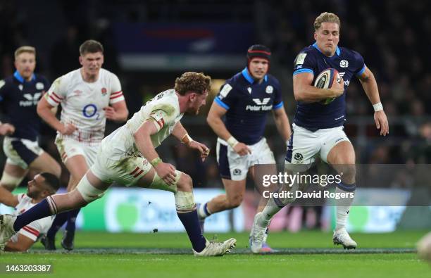 Duhan van der Merwe of Scotland goes past Ollie Chessum to score his first and Scotland's second try during the Six Nations Rugby match between...