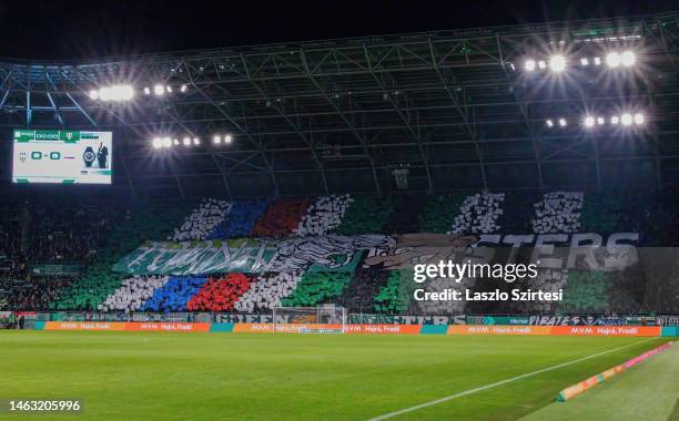 Ultra fans of Ferencvarosi TC perform a choreography about fabout their brotherhood with Tapid Wien prior to the Hungarian OTP Bank Liga match...