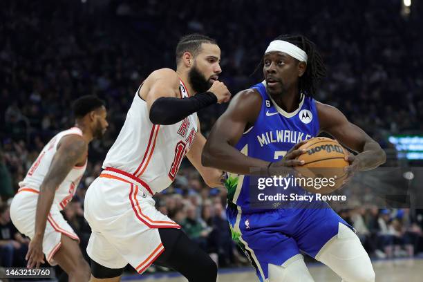 Jrue Holiday of the Milwaukee Bucks is defended by Caleb Martin of the Miami Heat during a game at Fiserv Forum on February 04, 2023 in Milwaukee,...