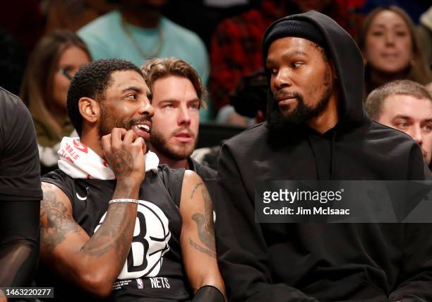 Kyrie Irving and Kevin Durant of the Brooklyn Nets look on against the Los Angeles Lakers at Barclays Center on January 30, 2023 in New York City....