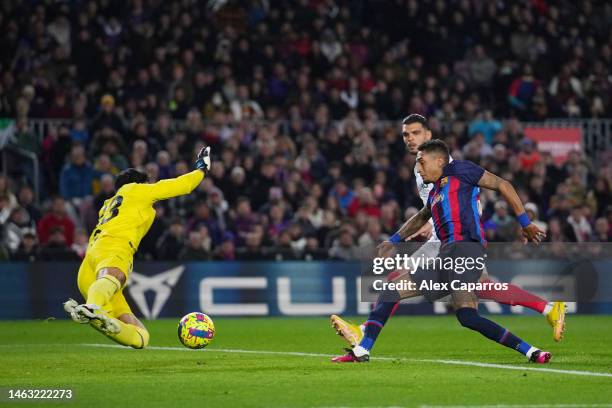 Raphinha of FC Barcelona scores the side's third goal during the LaLiga Santander match between FC Barcelona and Sevilla FC at Spotify Camp Nou on...