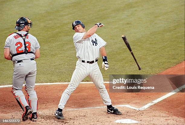 Catcher Chris Hoiles of the Baltimore Orioles watches on as catcher Joe Girardi of the New York Yankees reacts to being called out on strikes while...