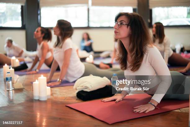 yoga positions, peaceful and healthy life, woman exercising, female lifestyle, exercise class - leisure facilities stock pictures, royalty-free photos & images
