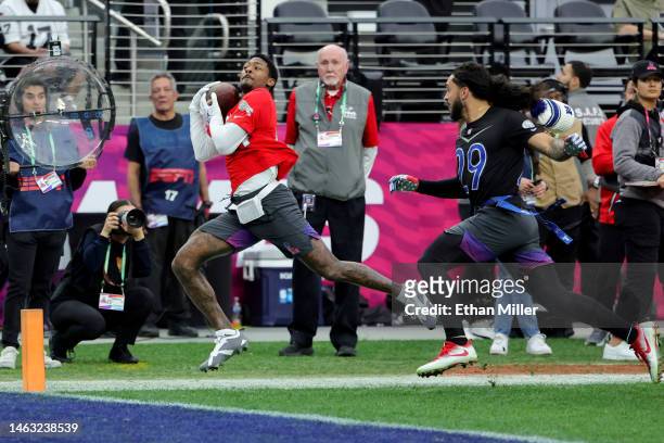 Stefon Diggs of the Buffalo Bills and AFC catches a pass for a touchdown against Talanoa Hufanga of the San Francisco 49ers and NFC during the 2023...
