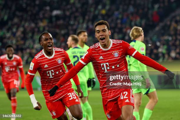 Jamal Musiala of Bayern Munich celebrates after scoring the team's fourth goal during the Bundesliga match between VfL Wolfsburg and FC Bayern...