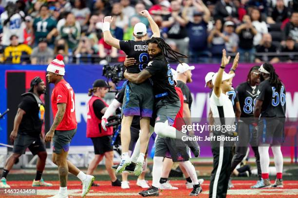 Kirk Cousins and Za'Darius Smith of the Minnesota Vikings and NFC celebrate in a game against the AFC during the 2023 NFL Pro Bowl Games at Allegiant...