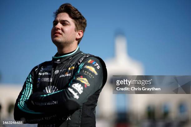 Noah Gragson, driver of the Sunseeker Resort Chevrolet, looks on during qualifying heats for the NASCAR Clash at the Coliseum at Los Angeles Memorial...