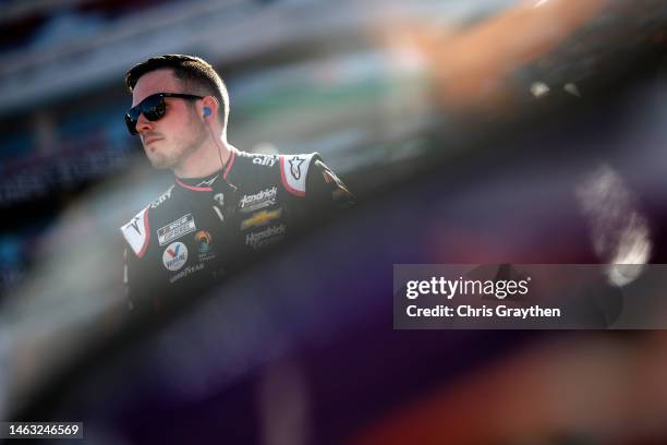 Alex Bowman, driver of the Ally Chevrolet, looks on during qualifying heats for the NASCAR Clash at the Coliseum at Los Angeles Memorial Coliseum on...