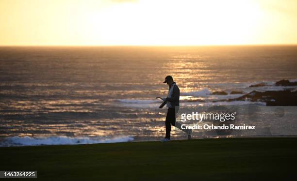Justin Rose of England walks down the ninth hole during the final round of the AT&T Pebble Beach Pro-Am at Pebble Beach Golf Links on February 05,...