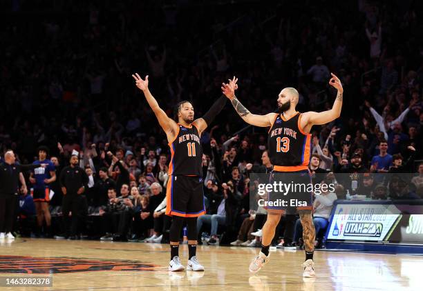 Jalen Brunson and Evan Fournier of the New York Knicks celebrate in the fourth quarter against the Philadelphia 76ers at Madison Square Garden on...