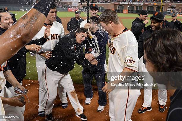 Matt Cain of the San Francisco Giants is sprayed with a beer by teammate Ryan Theriot after the game against the Houston Astros at AT&T Park on...