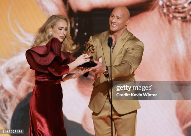 Adele accepts the Best Pop Solo Performance award for “Easy On Me” from Dwayne Johnson onstage during the 65th GRAMMY Awards at Crypto.com Arena on...