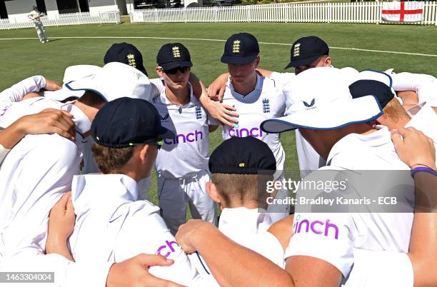 The England team embrace during day 1 of the Second Test match between Australia U19 and England U19 at Norths Cricket Club on February 06, 2023 in...