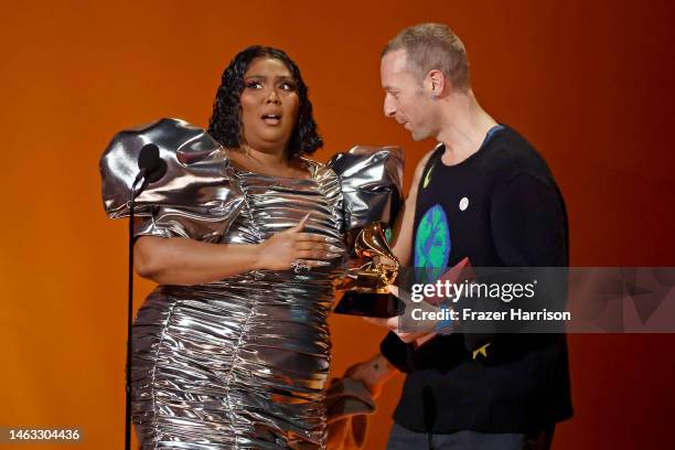 Lizzo accepts the Record Of The Year award for “About Damn Time” from Chris Martin onstage during the 65th GRAMMY Awards at Crypto.com Arena on...