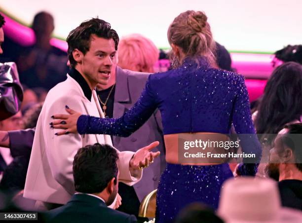 Harry Styles and Taylor Swift speak during the 65th GRAMMY Awards at Crypto.com Arena on February 05, 2023 in Los Angeles, California.