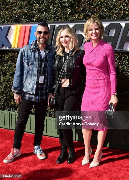 Personality Riki Rachtman, guest and FOX Sports NASCAR host Shannon Spake pose for photos on the red carpet prior to the NASCAR Clash at the Coliseum...