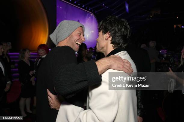 Chris Martin and Harry Styles attend the 65th GRAMMY Awards at Crypto.com Arena on February 05, 2023 in Los Angeles, California.