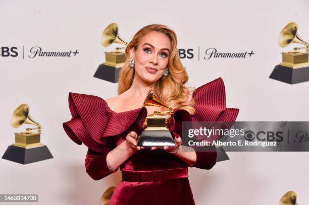 Adele poses with the Best Pop Solo Performance Award for "Easy on Me" in the press room during the 65th GRAMMY Awards at Crypto.com Arena on February...