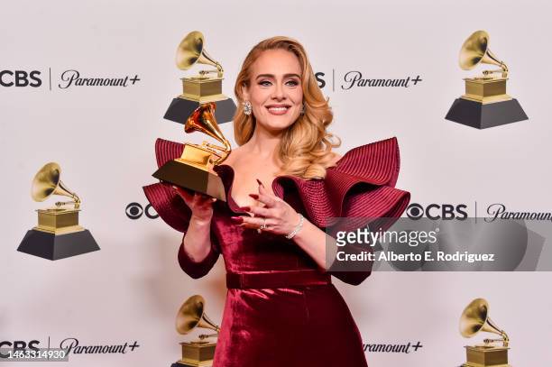 Adele poses with the Best Pop Solo Performance Award for "Easy on Me" in the press room during the 65th GRAMMY Awards at Crypto.com Arena on February...