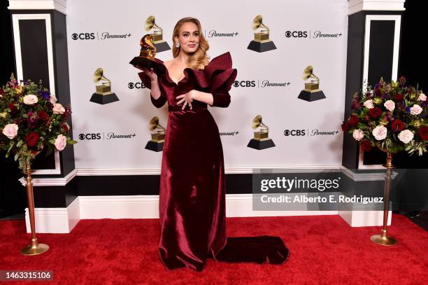 Adele poses with the Best Pop Solo Performance Award for "Easy on Me" in the press room during the 65th GRAMMY Awards at Crypto.com Arena on February...