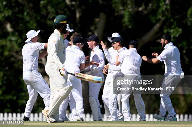 Jack Harding of England is congratulated by team mates after taking the wicket of Harjas Singh of Australia during day 1 of the Second Test match...