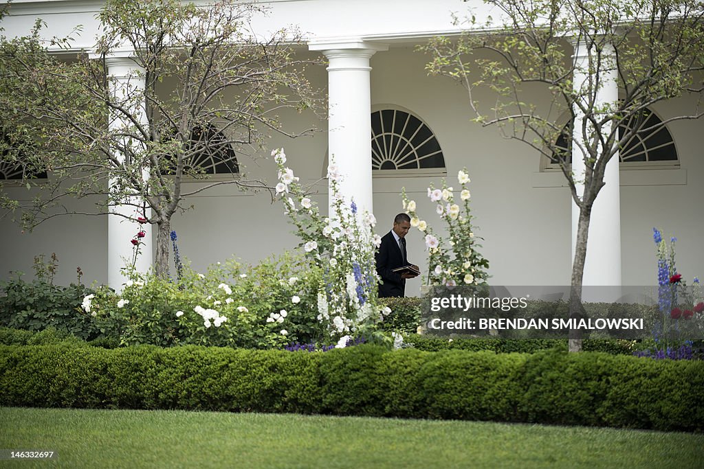 US President Barack Obama walks through 