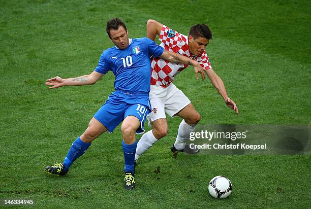 Ognjen Vukojevic of Croatia and Antonio Cassano of Italy battle for the ball during the UEFA EURO 2012 group C match between Italy and Croatia at The...