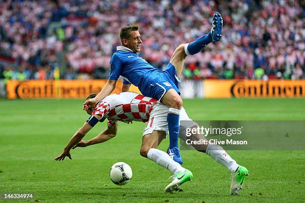 Emanuele Giaccherini of Italy clashes with Darijo Srna of Croatia during the UEFA EURO 2012 group C match between Italy and Croatia at The Municipal...