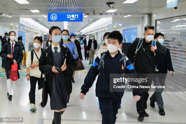 Travelers pass the Lo Wu checkpoint as cross-border travel has been fully resumed on February 6, 2023 in Shenzhen, Guangdong Province of China. All...