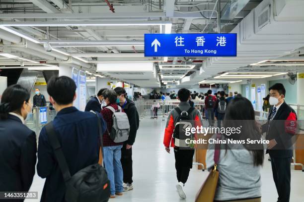 Travelers pass the Lo Wu checkpoint as cross-border travel has been fully resumed on February 6, 2023 in Shenzhen, Guangdong Province of China. All...