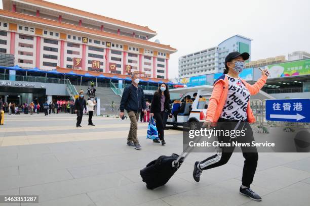 Traveler walks out of the Lo Wu checkpoint as cross-border travel has been fully resumed on February 6, 2023 in Shenzhen, Guangdong Province of...