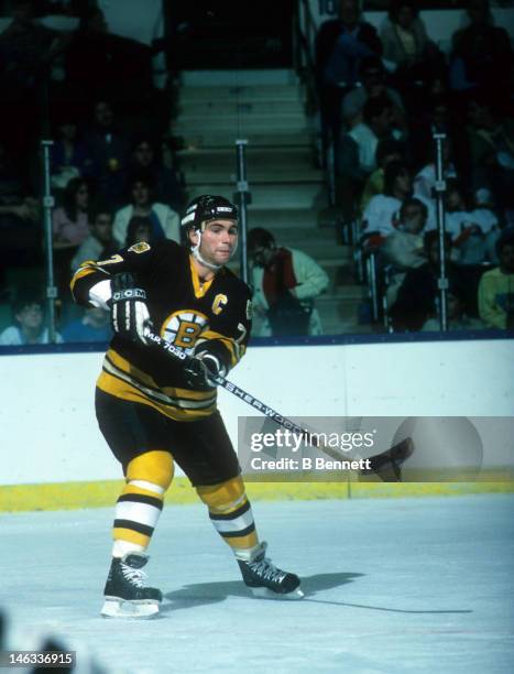 Ray Bourque of the Boston Bruins passes the puck during an NHL game against the New York Islanders circa 1985 at the Nassau Coliseum in Uniondale,...