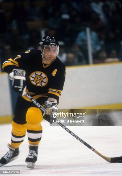 Ray Bourque of the Boston Bruins skates with the puck during an NHL game against the New Jersey Devils on October 11, 1986 at the Brendan Byrne Arena...