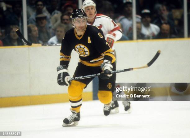 Ray Bourque of the Boston Bruins skates with the puck during an NHL game against the New Jersey Devils on October 11, 1986 at the Brendan Byrne Arena...