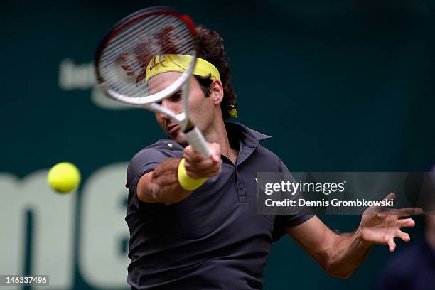 Roger Federer of Suisse plays a forehand in his round of 16 match against Florian Mayer of Germany during day four of the Gerry Weber Open at Gerry...