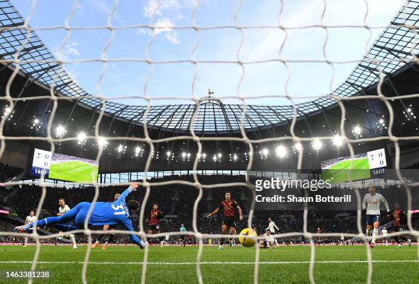Harry Kane of Tottenham Hotspur scores the team's first goal past Ederson of Manchester City during the Premier League match between Tottenham...