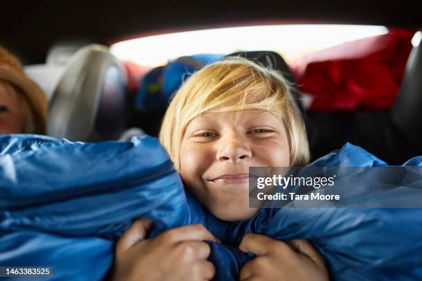 boy smiling on road trip - blonde hair boy stock pictures, royalty-free photos & images