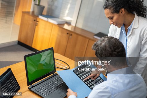 Doctors looking x-rays Doctors looking x-rays