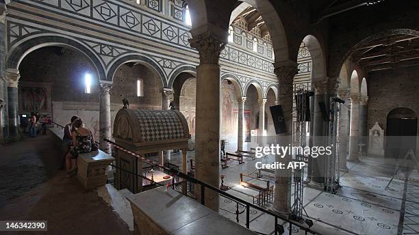 People visit San Minato al Monte church in Florence while workers prepare ahead of the wedding of Princess Carolina of Bourbon Parma and Albert...