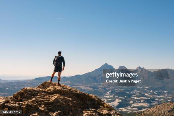 hiker looks out over the view - vitoria spain - fotografias e filmes do acervo