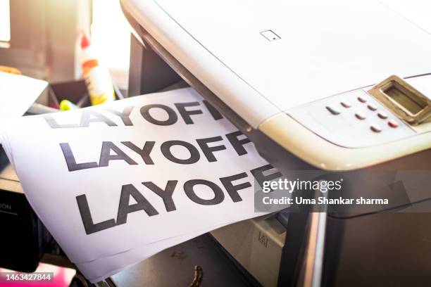 printing layoff notice in office. - printer frustration stock pictures, royalty-free photos & images