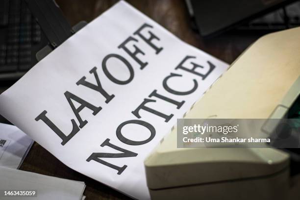 printed layoff notice in office. - printer frustration stock pictures, royalty-free photos & images